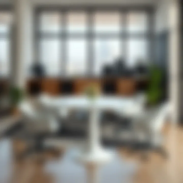 Tall round white table as a centerpiece in a modern workspace