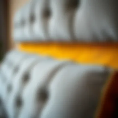 Close-up of gray and gold fabric texture on a stylish headboard